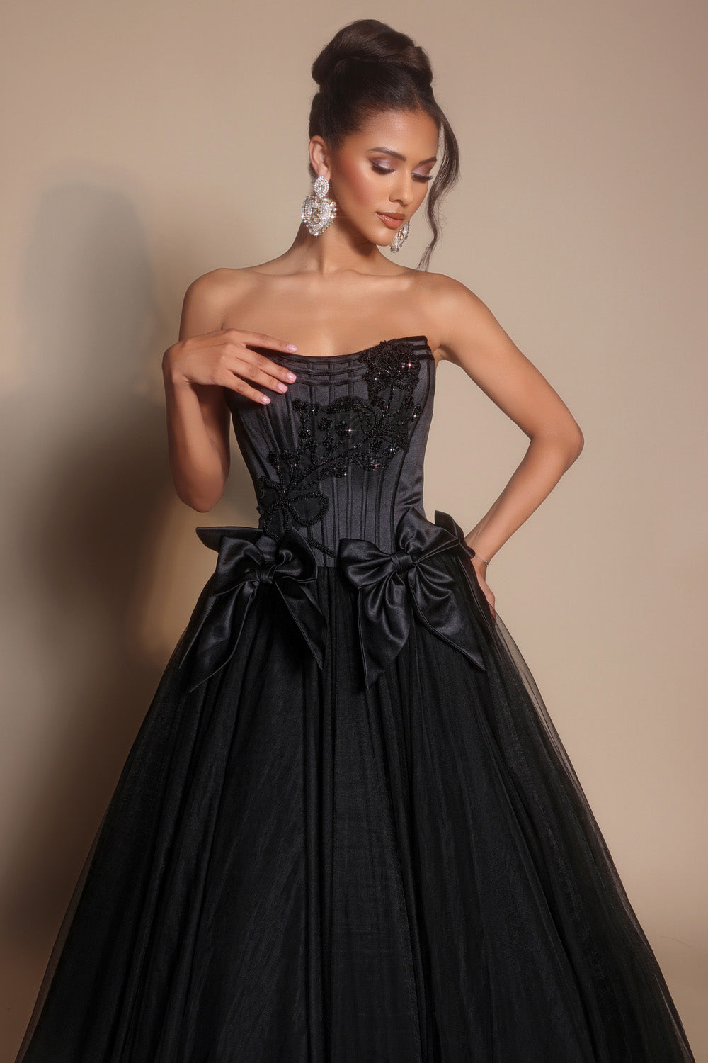 Portia and Scarlett PS26102 Black ballgown prom dress with corset bodice and elegant bow details.