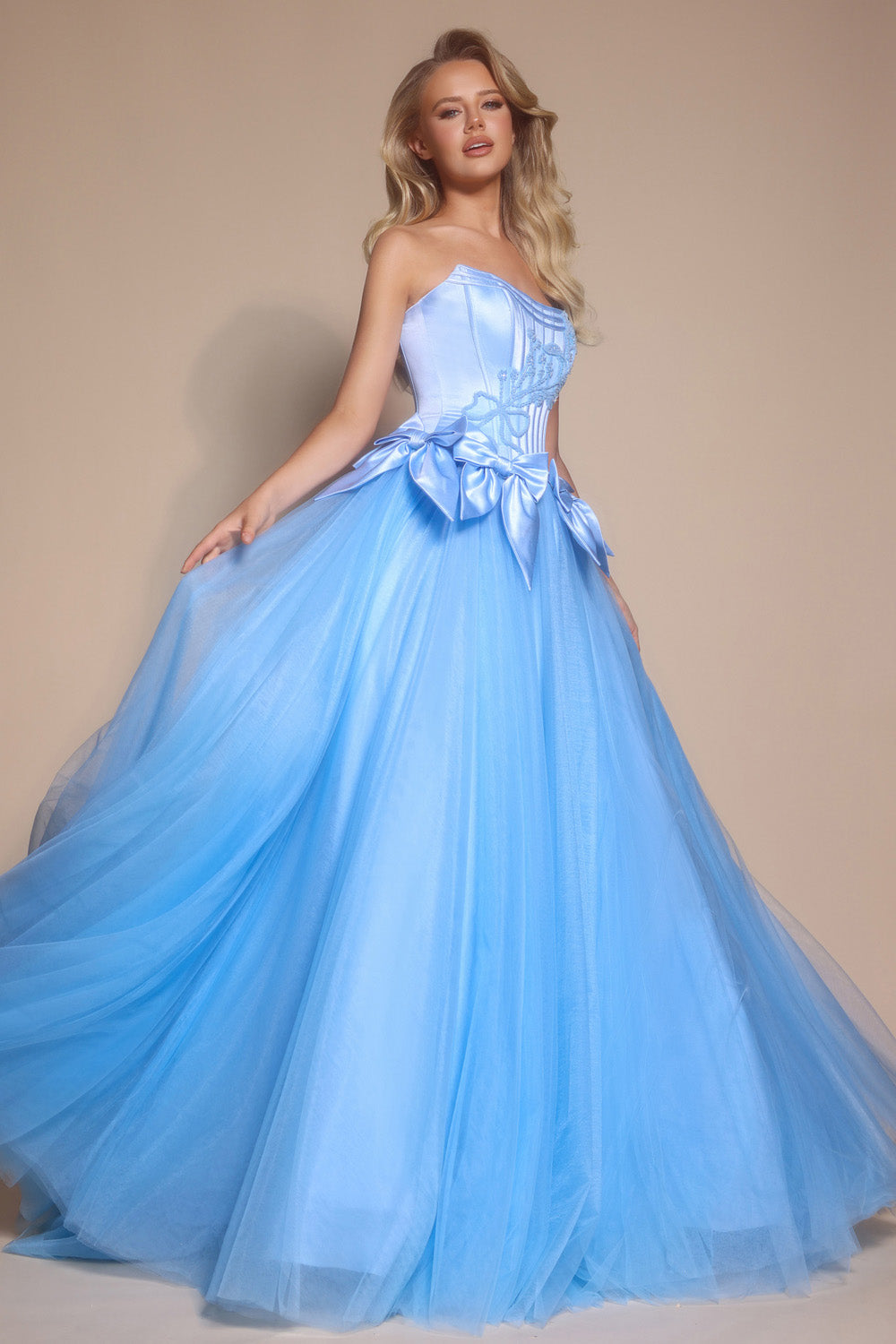 Portia and Scarlett PS26102 Light blue ballgown prom dress with a corset bodice and flowing tulle skirt.