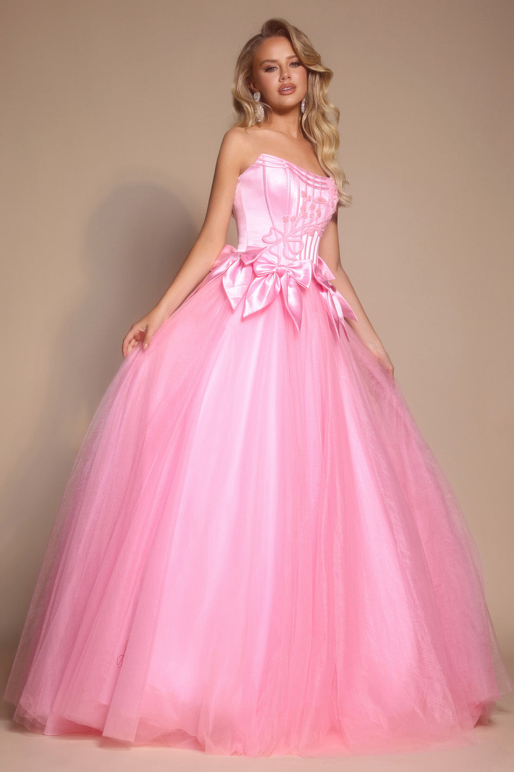 Portia and Scarlett PS26102 Light pink ballgown prom dress with a corset bodice and oversized bow detail.
