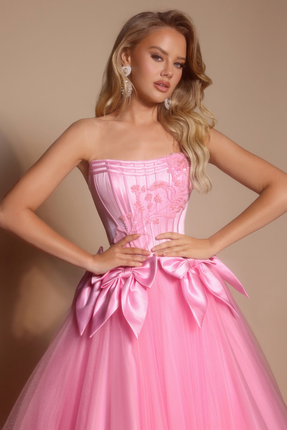 Portia and Scarlett PS26102 Light pink ballgown with corset bodice and oversized satin bows prom dress.