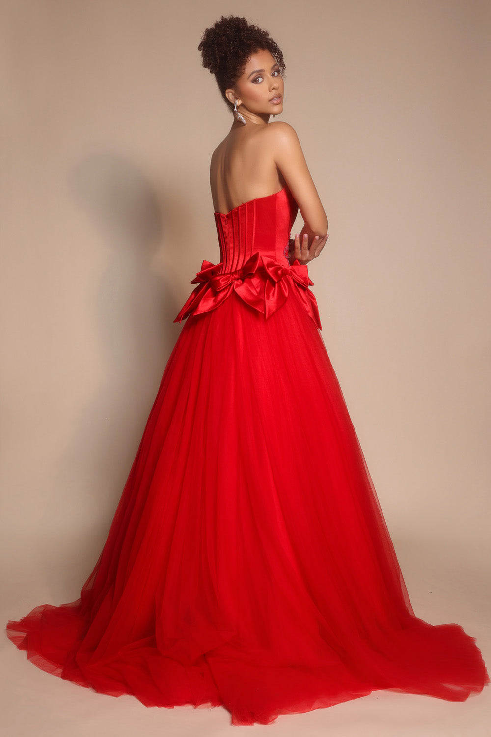 Portia and Scarlett PS26102 Red ballgown prom dress with a corset back and dramatic bow detail.