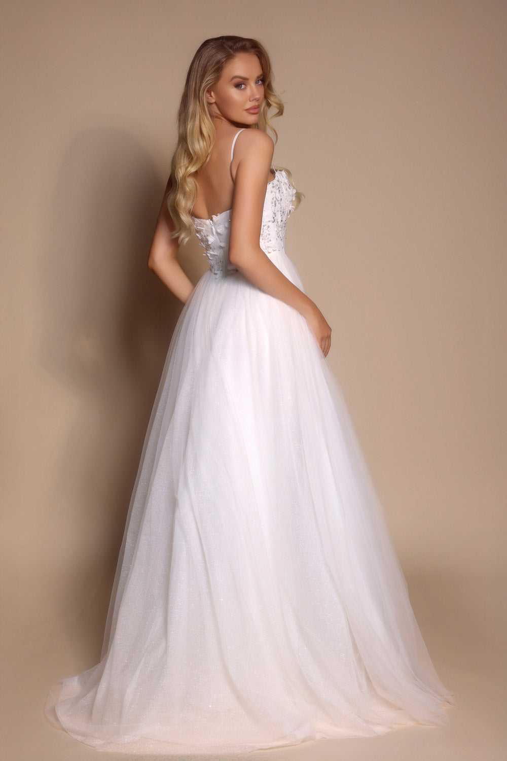 Portia and Scarlett PS26146 Ivory A-line prom dress with beaded bodice and lace-up back, back view.