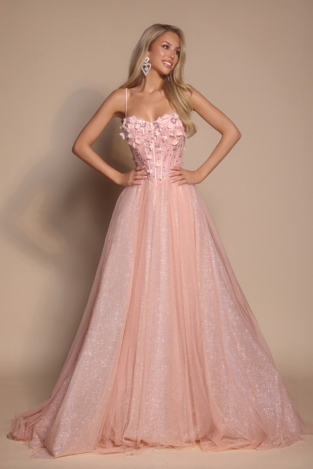 Portia and Scarlett PS26146 Pink A-line prom dress with floral embellishments and a corset bodice.