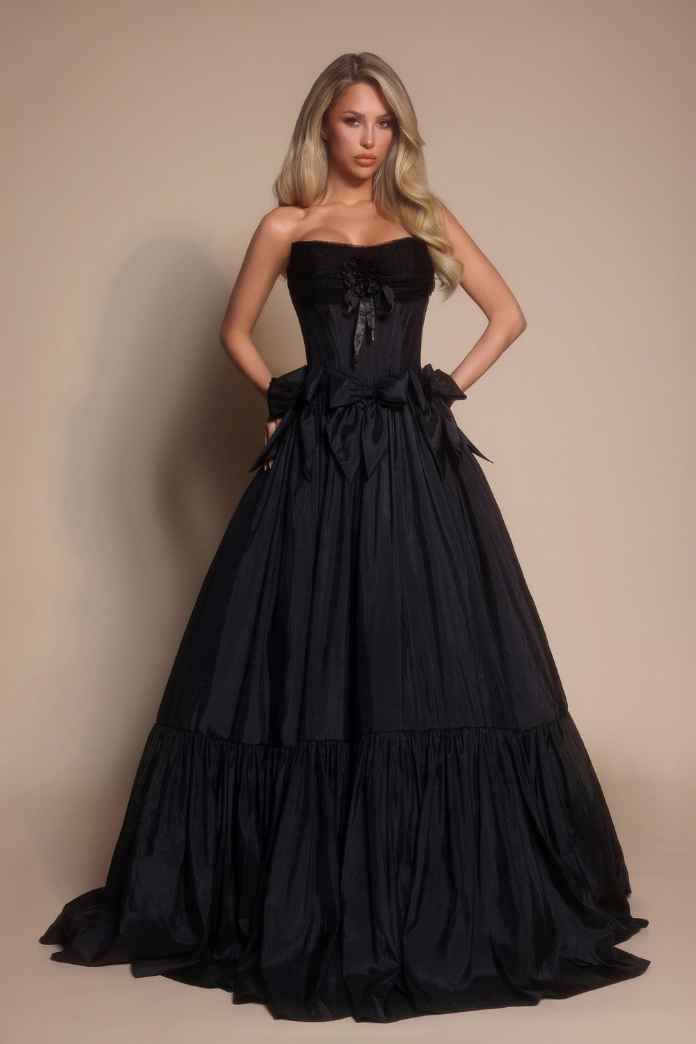 Portia and Scarlett PS26148 Black ballgown prom dress with a strapless design and elegant bow details.