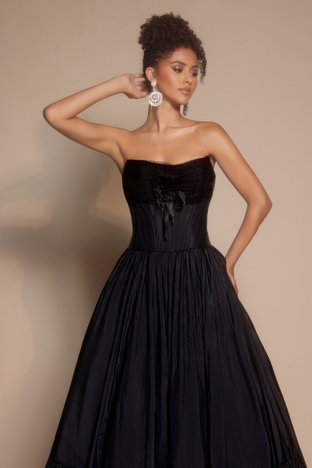 Portia and Scarlett PS26148 Strapless black prom dress with a fitted bodice and flowing skirt.