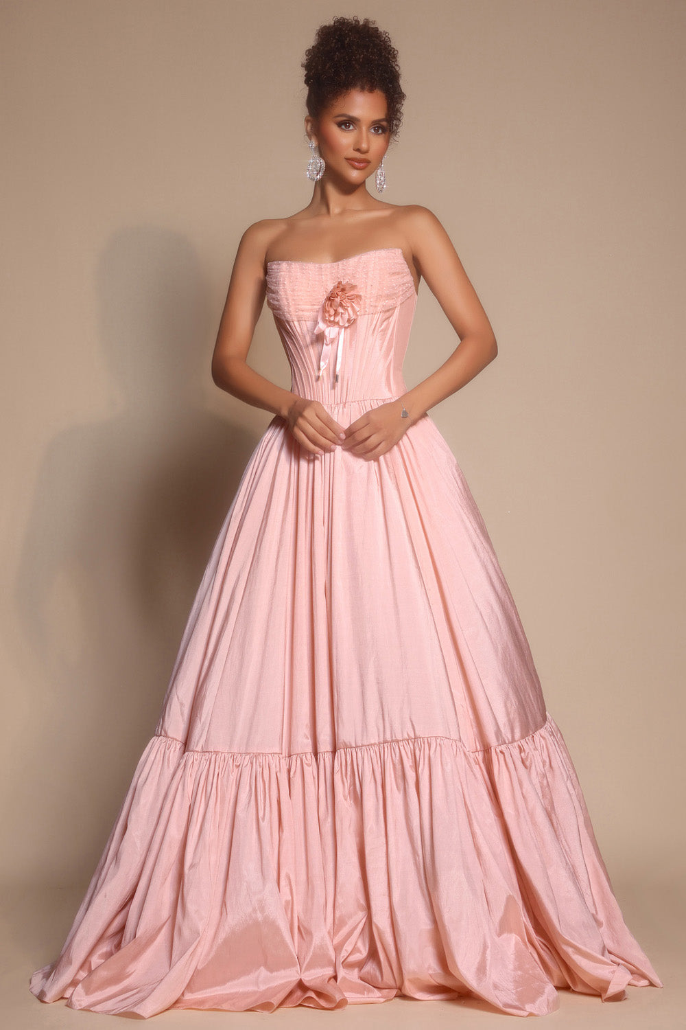 Portia and Scarlett PS26148 Blush ballgown prom dress with a floral accent and strapless neckline.