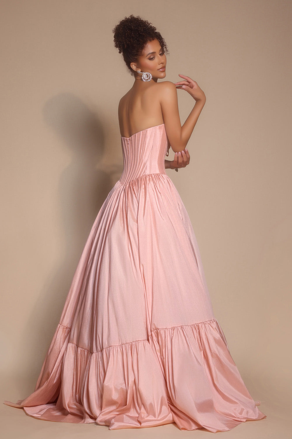 Portia and Scarlett PS26148 Blush prom dress with a fitted bodice and flowing skirt, featuring a lace-up back.