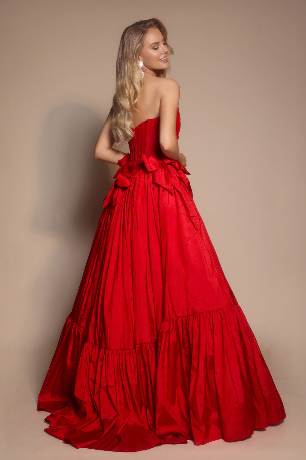 Portia and Scarlett PS26148 Red ballgown with a corset back and ruffled skirt, perfect for prom prom dress.