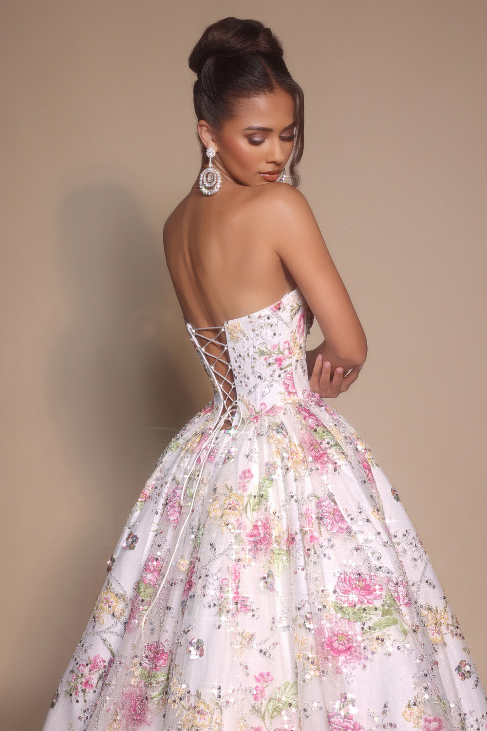Portia and Scarlett PS26215 Pink ivory formal gown with floral embellishments and lace-up back, back view.