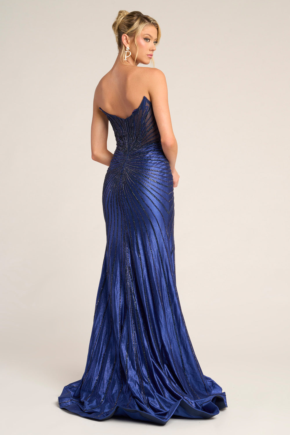Portia and Scarlett PS26250 Navy mermaid prom dress with a stunning beaded back design.