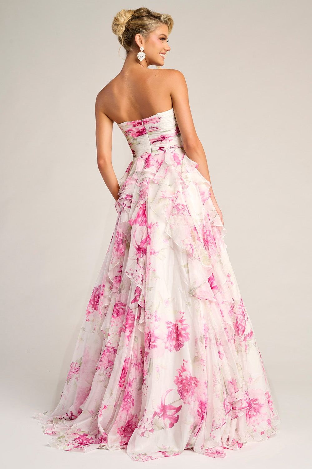 Portia and Scarlett PS26254 Strapless white and pink floral prom dress with layered ruffles and a flowing silhouette.