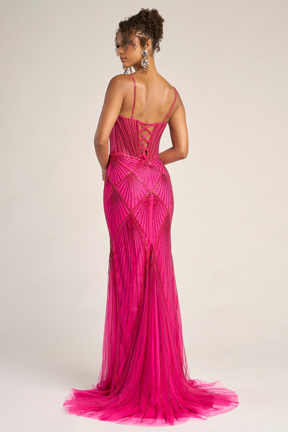 Portia and Scarlett PS26263 Fuchsia red mermaid prom dress with a lace-up back and intricate beading, back view.