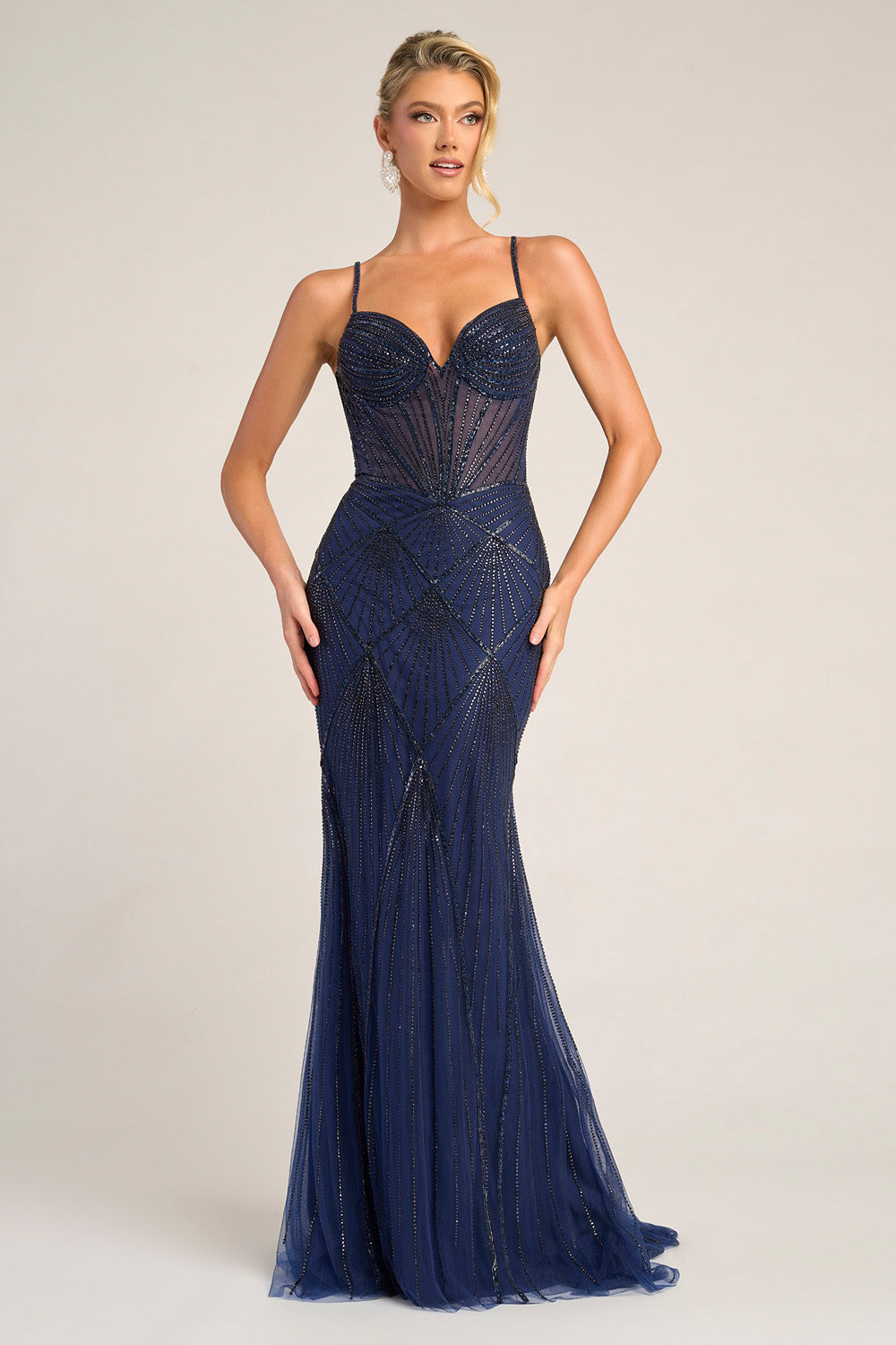 Portia and Scarlett PS26263 Navy mermaid prom dress with intricate beading and a sweetheart neckline.
