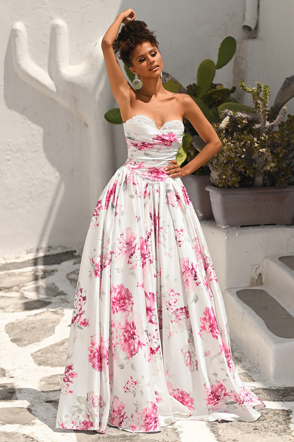 Portia and Scarlett PS26298 White and pink floral prom dress with a fitted bodice and flowing A-line skirt.
