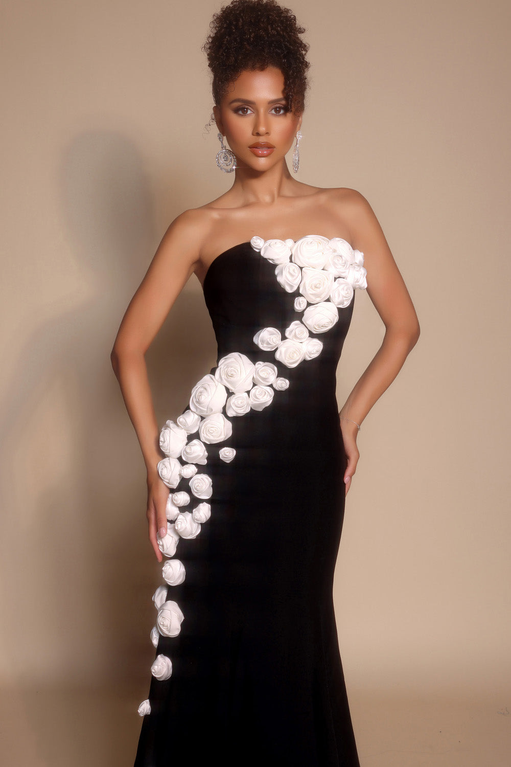 Portia and Scarlett PS26305e Black mermaid prom dress with floral embellishments and a side slit.