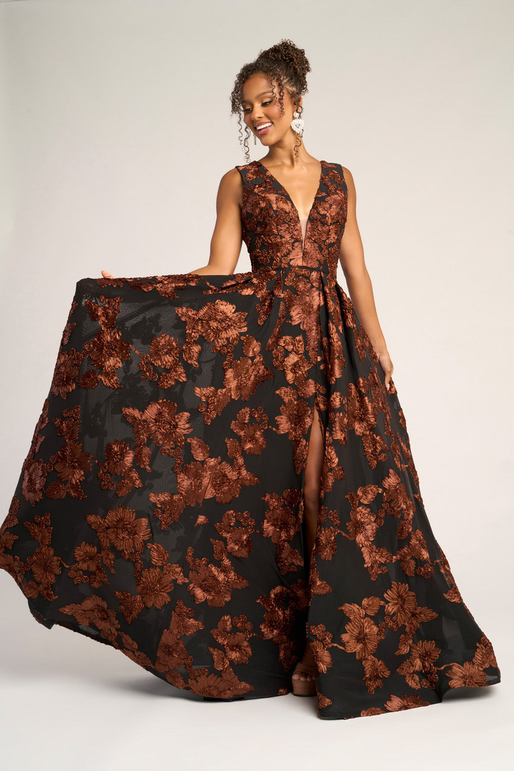 Portia and Scarlett PS26312e Black and brown floral prom dress with a deep V-neck and side slit.