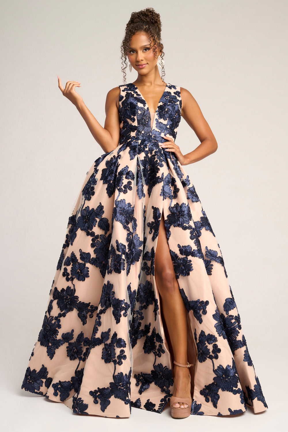 Portia and Scarlett PS26312e Navy nude formal gown with floral embroidery and a high slit, front view.