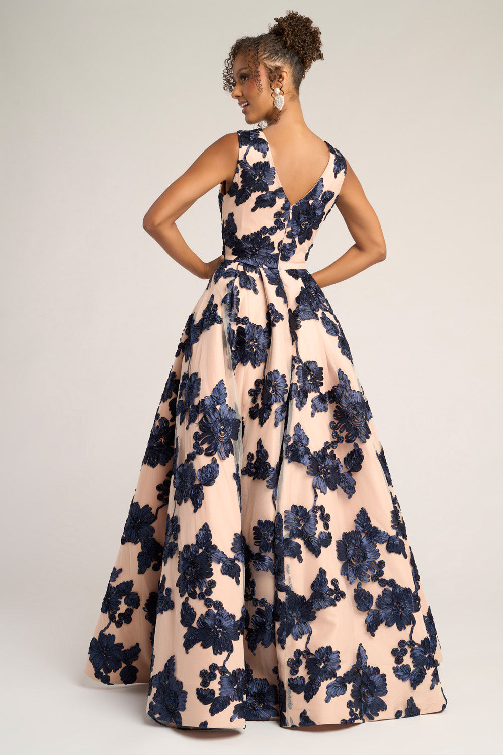 Portia and Scarlett PS26312e Navy and nude floral ballgown with a deep V-back and full skirt for prom prom dress.