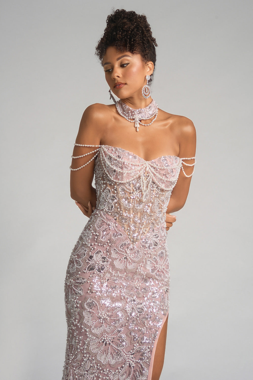 Portia and Scarlett PS26322e Ivory blush mermaid prom dress with sequins and a thigh-high slit.