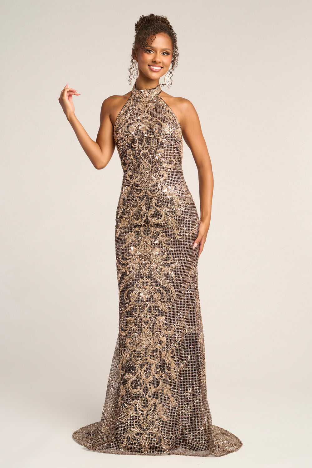 Portia and Scarlett PS26324e Black and gold mermaid prom dress with intricate sequins and halter neckline.