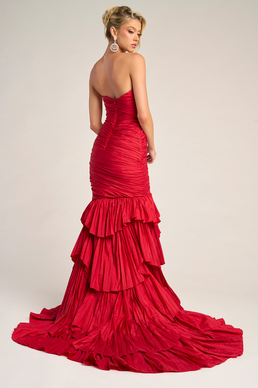 Portia and Scarlett PS26325e Red mermaid prom dress with layered ruffles and a sleek back view.