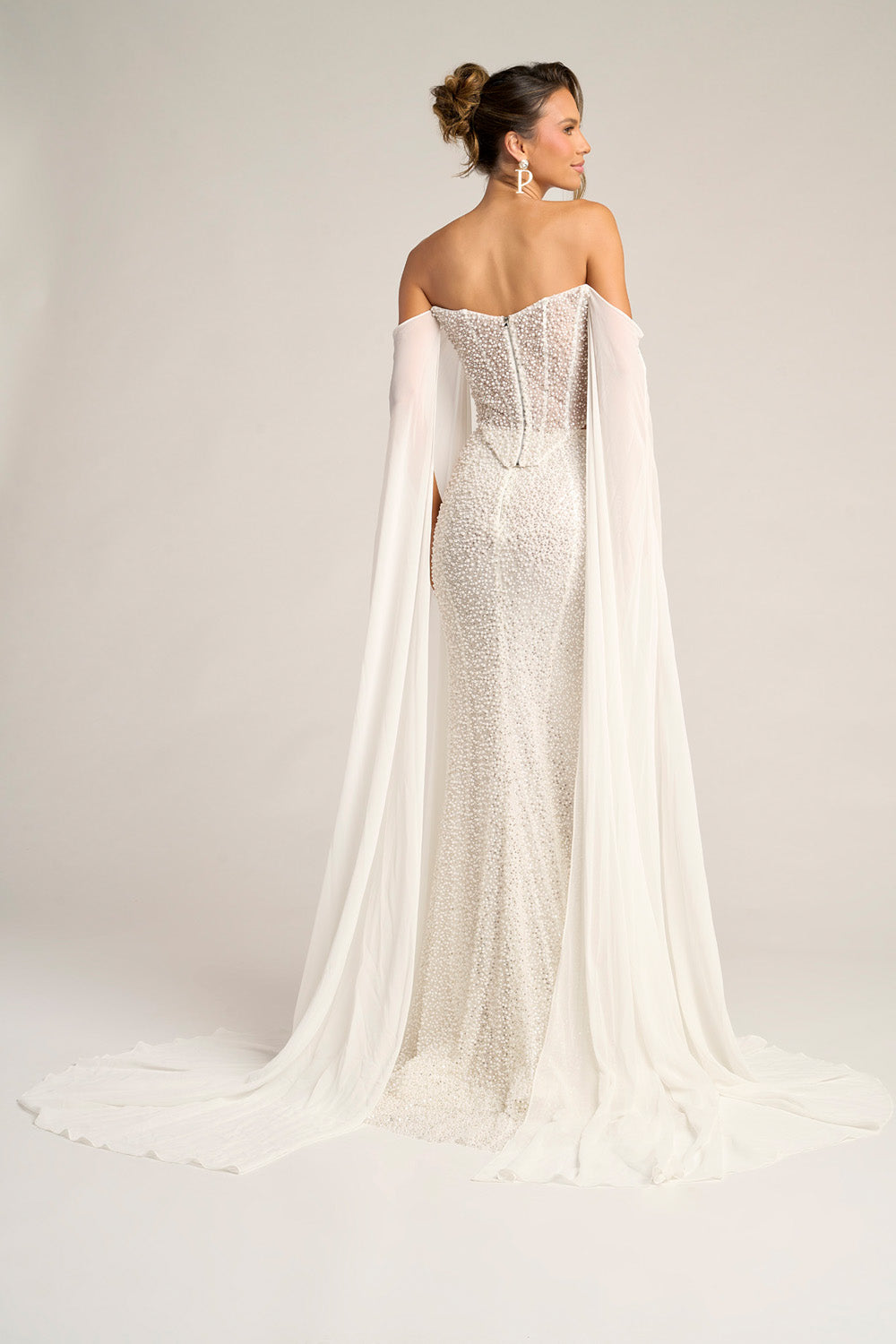 Portia and Scarlett PS26326e Ivory mermaid prom dress with beading and a flowing cape, back view.
