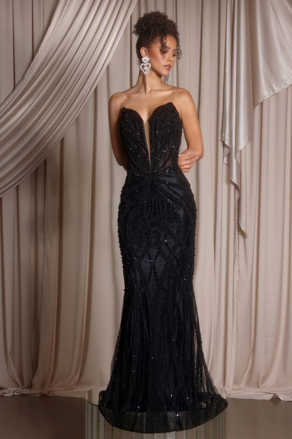 Portia and Scarlett PS26401c Black mermaid prom dress with intricate beading and a plunging neckline.