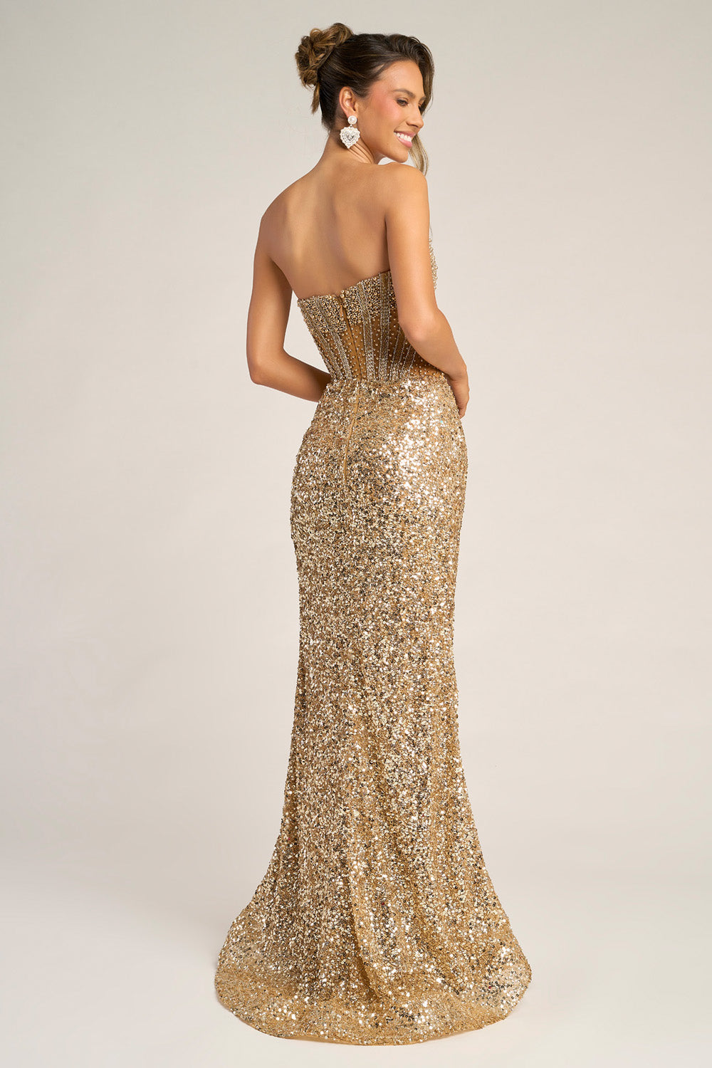 Portia and Scarlett PS26430c Gold mermaid prom dress with sequins and a lace-up back, back view.