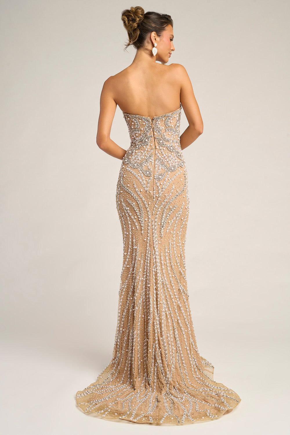 Portia and Scarlett PS26446c Nude silver mermaid prom dress with intricate beading and a back zipper closure.