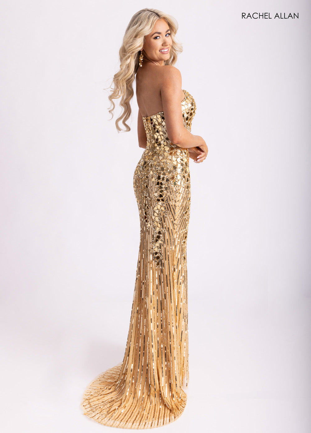 Rachel Allan 70937 Gold mermaid prom dress with stunning beading and a lace-up back.