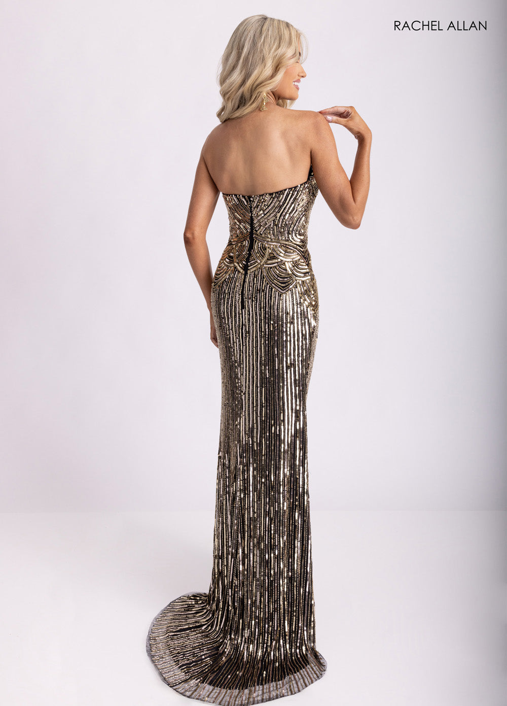 Rachel Allan 70948 Strapless black and gold mermaid prom dress with stunning beading and lace-up back.
