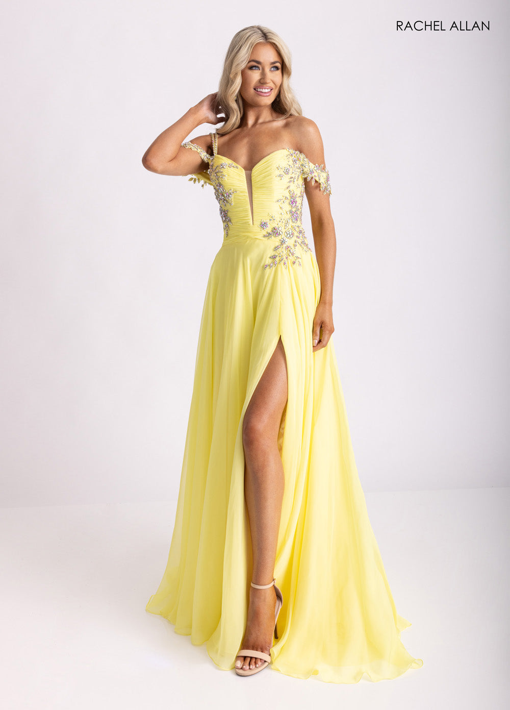 Rachel Allan 70951 Yellow chiffon prom dress with corset bodice and high slit, front view.