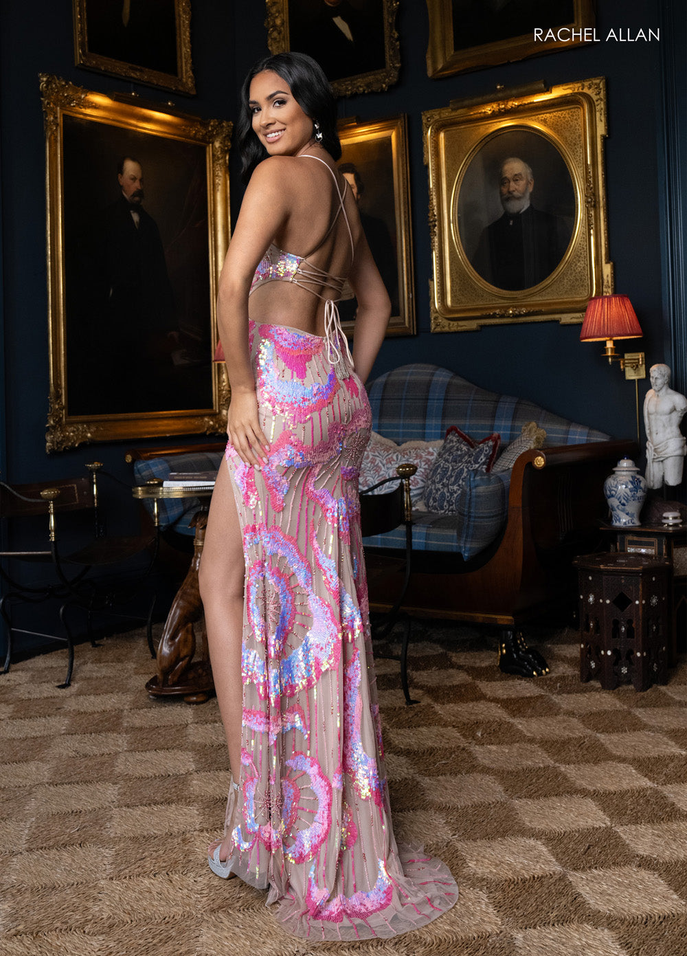 Rachel Allan 70962 Fitted prom dress in nude pink with sequins and a high slit, back view.