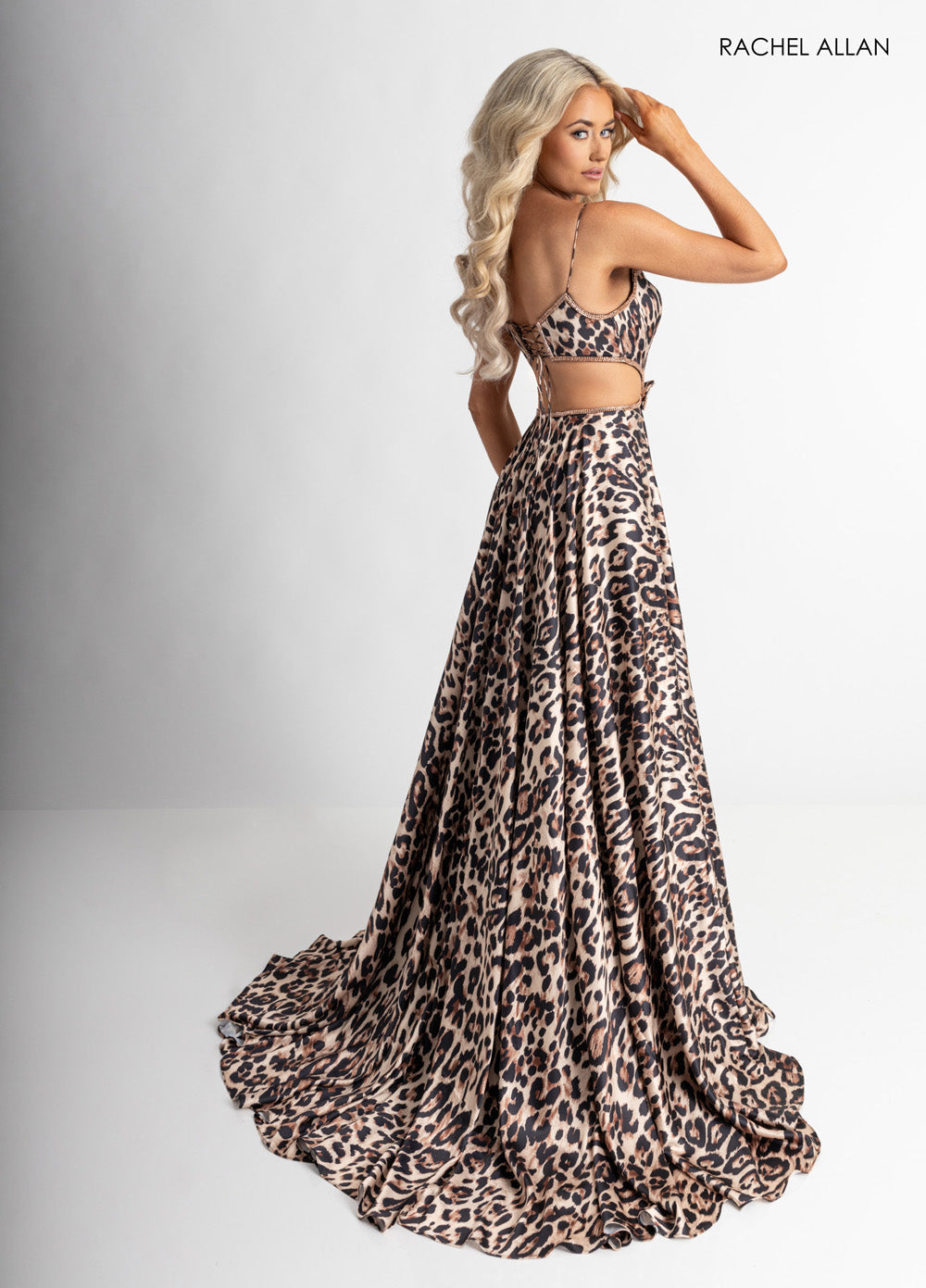 Rachel Allan 70963 Cheetah print prom dress with crystal beading and a flowing A-line silhouette.