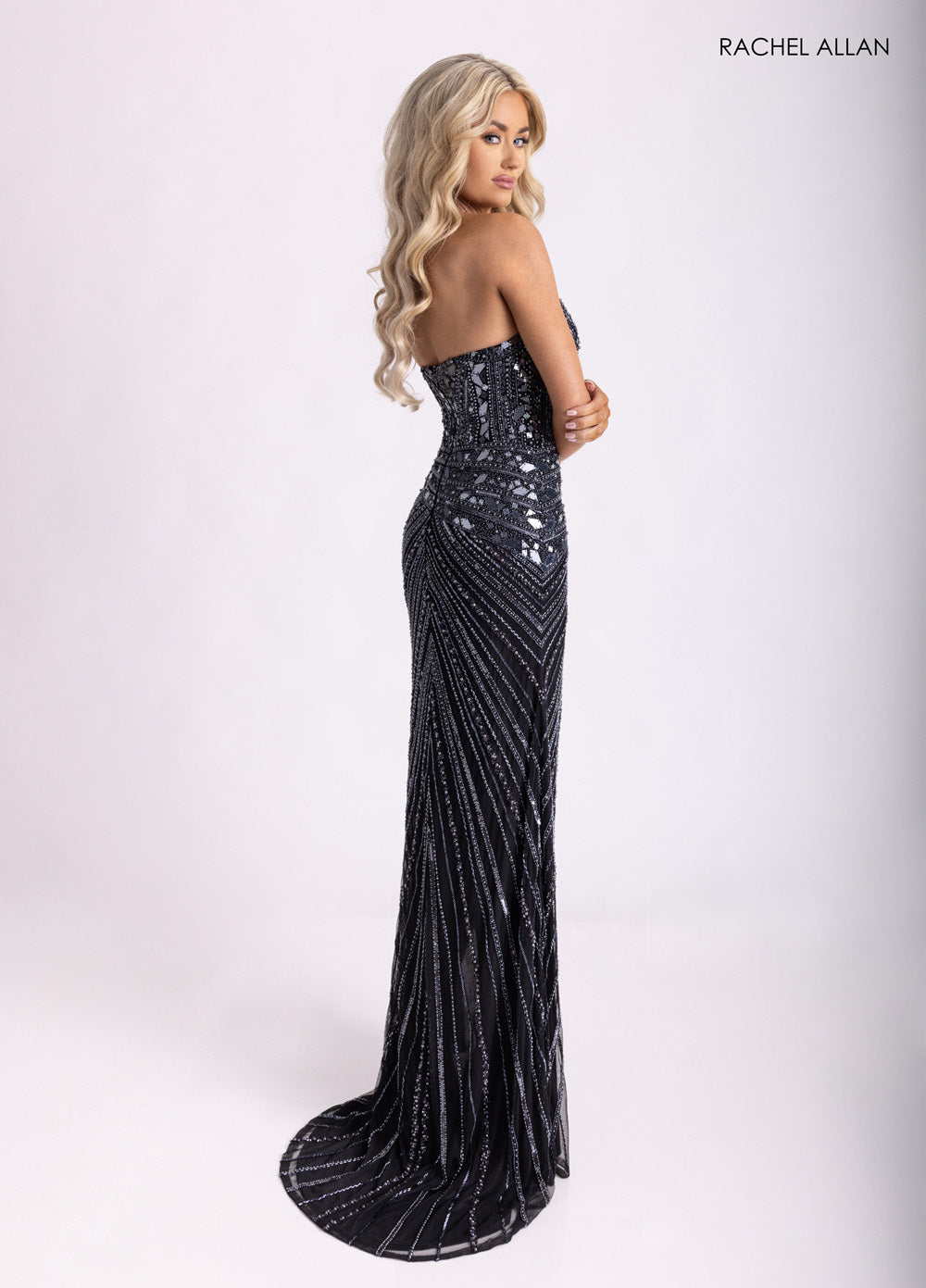 Rachel Allan 70964 Black mermaid prom dress with beading and a stunning side view.
