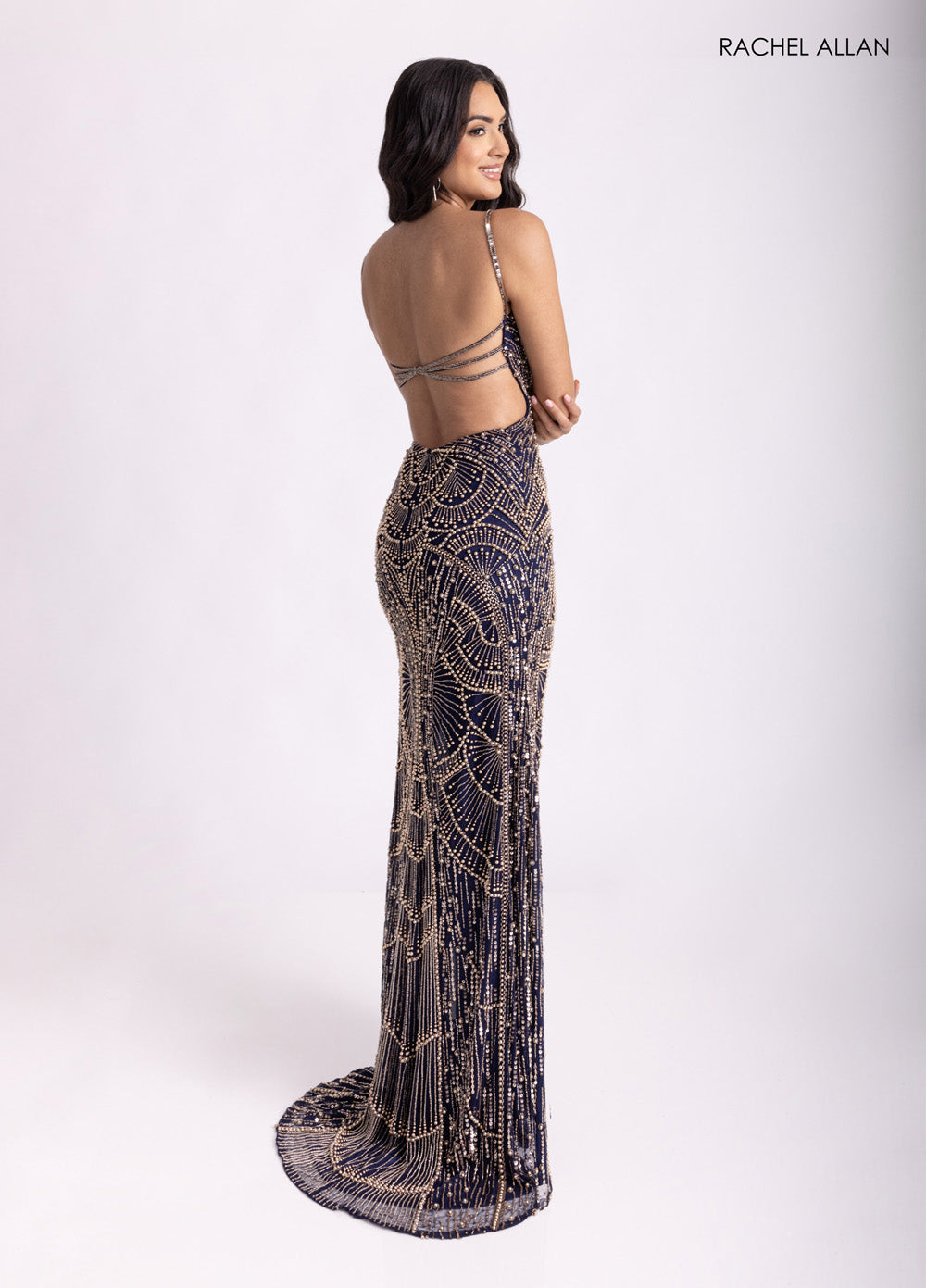 Rachel Allan 70970 Navy fitted prom dress with pearl beading and a stunning open back view.