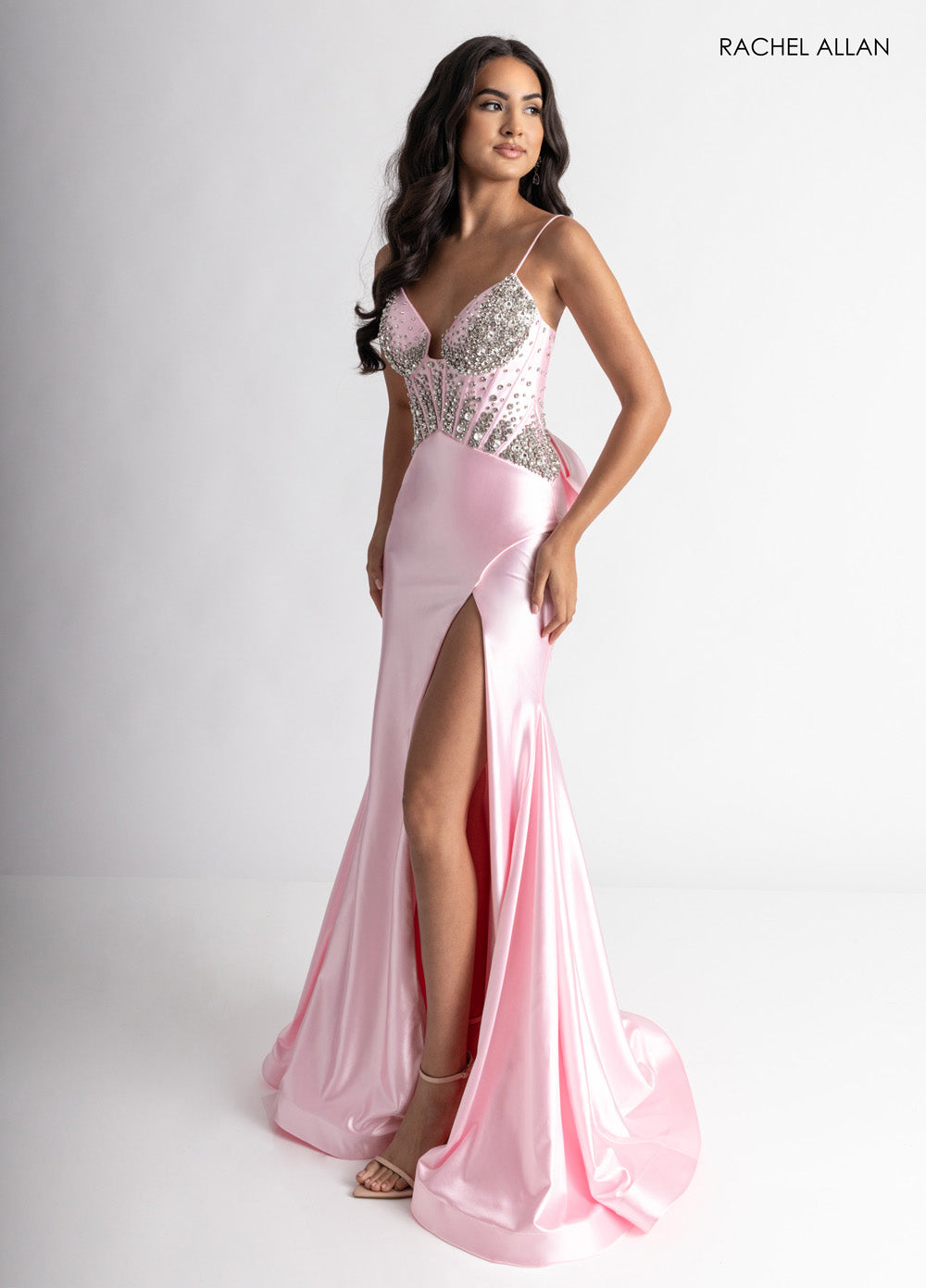 Rachel Allan 70971 Pink fitted prom dress with crystal beading and a thigh-high slit.