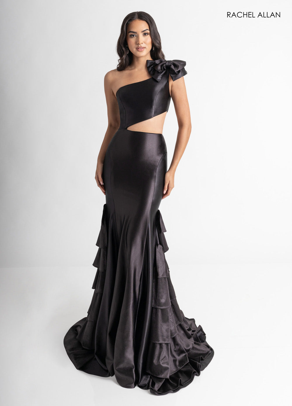 Rachel Allan 70976 Black mermaid prom dress with a corset bodice and ruffled hem detail.