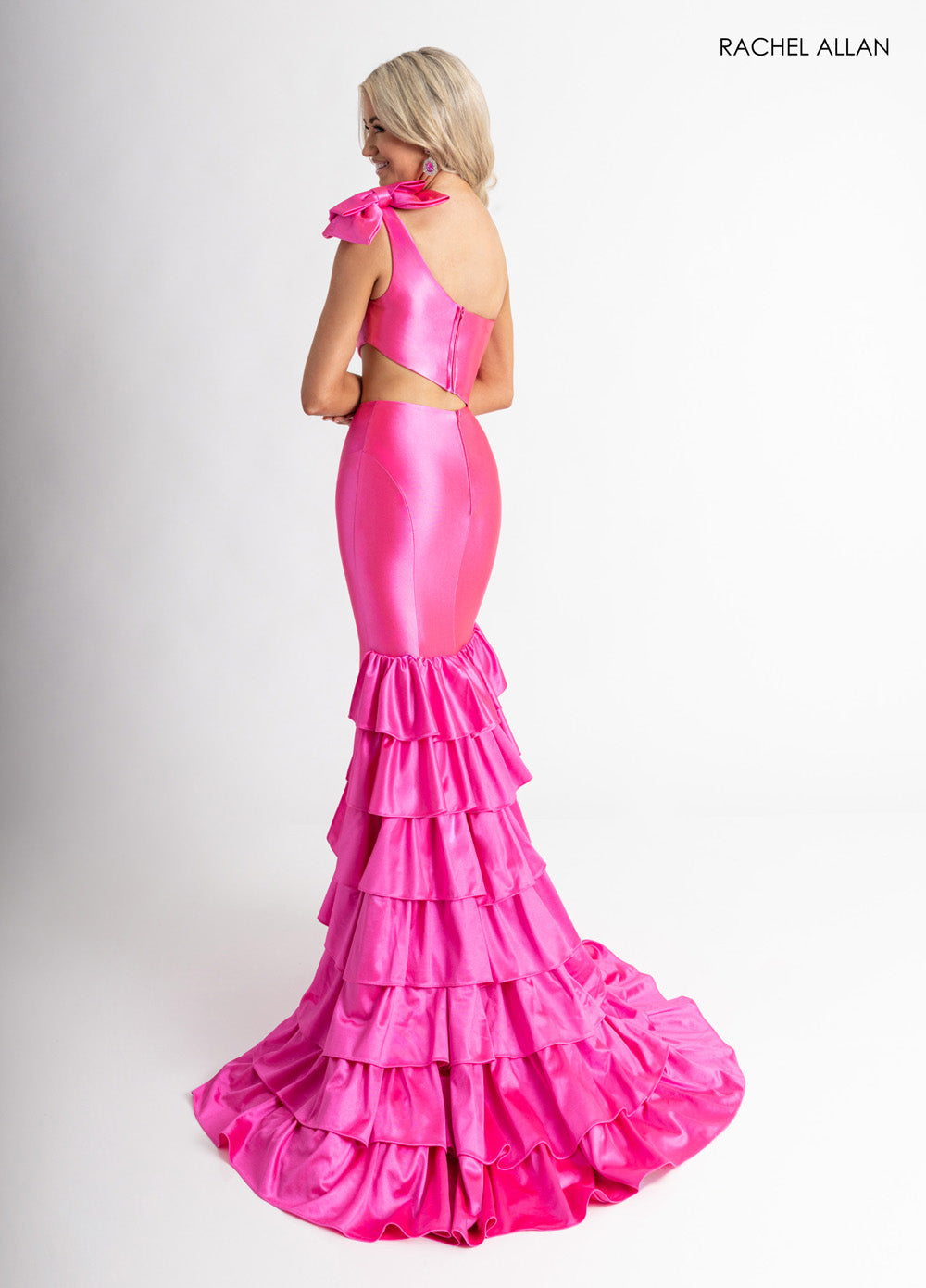 Rachel Allan 70976 Fuchsia mermaid prom dress with ruffled layers and a stylish open back.
