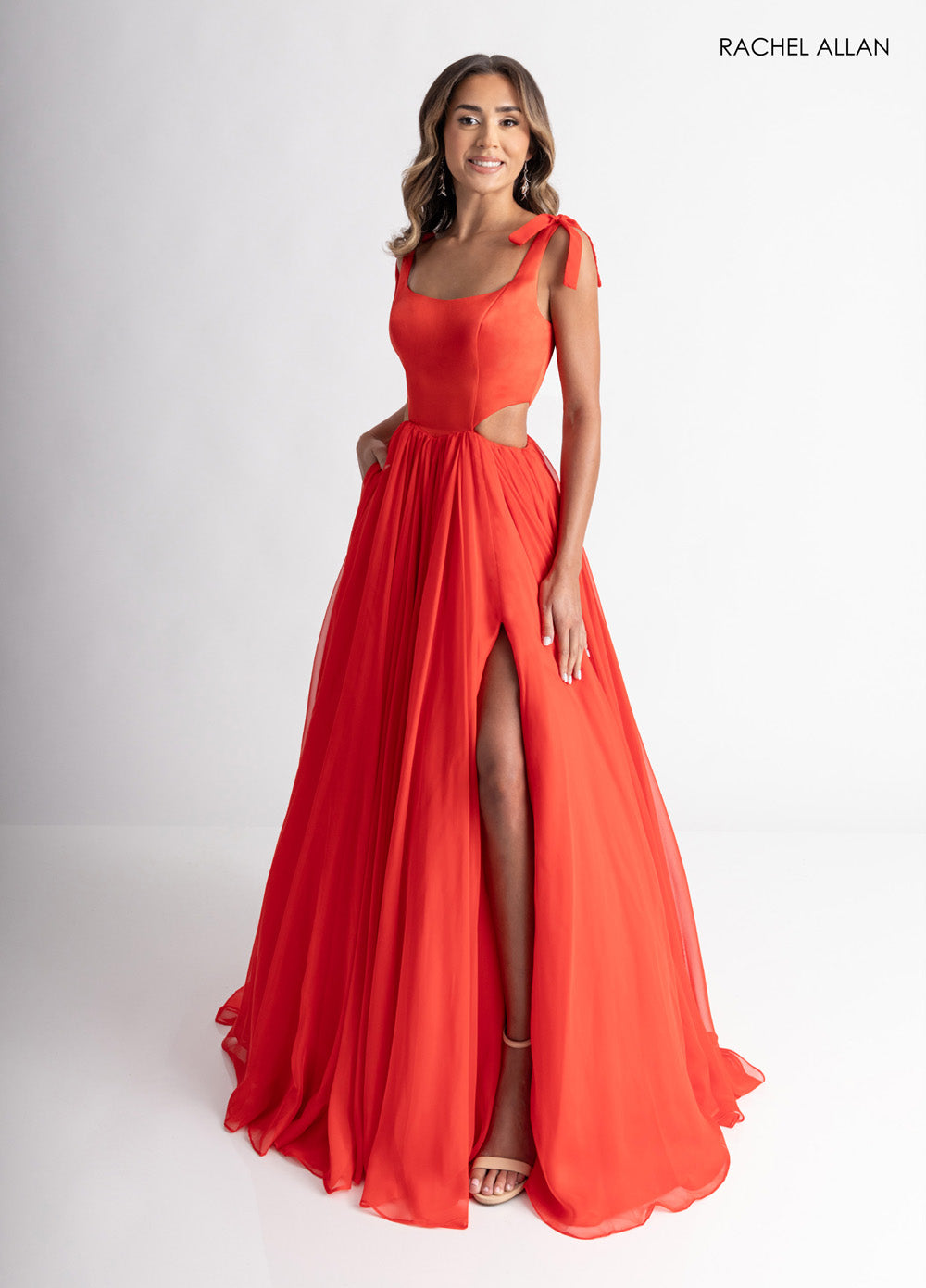 Rachel Allan 70980 Red A-line prom dress with lace-up low back and side slit, front view.