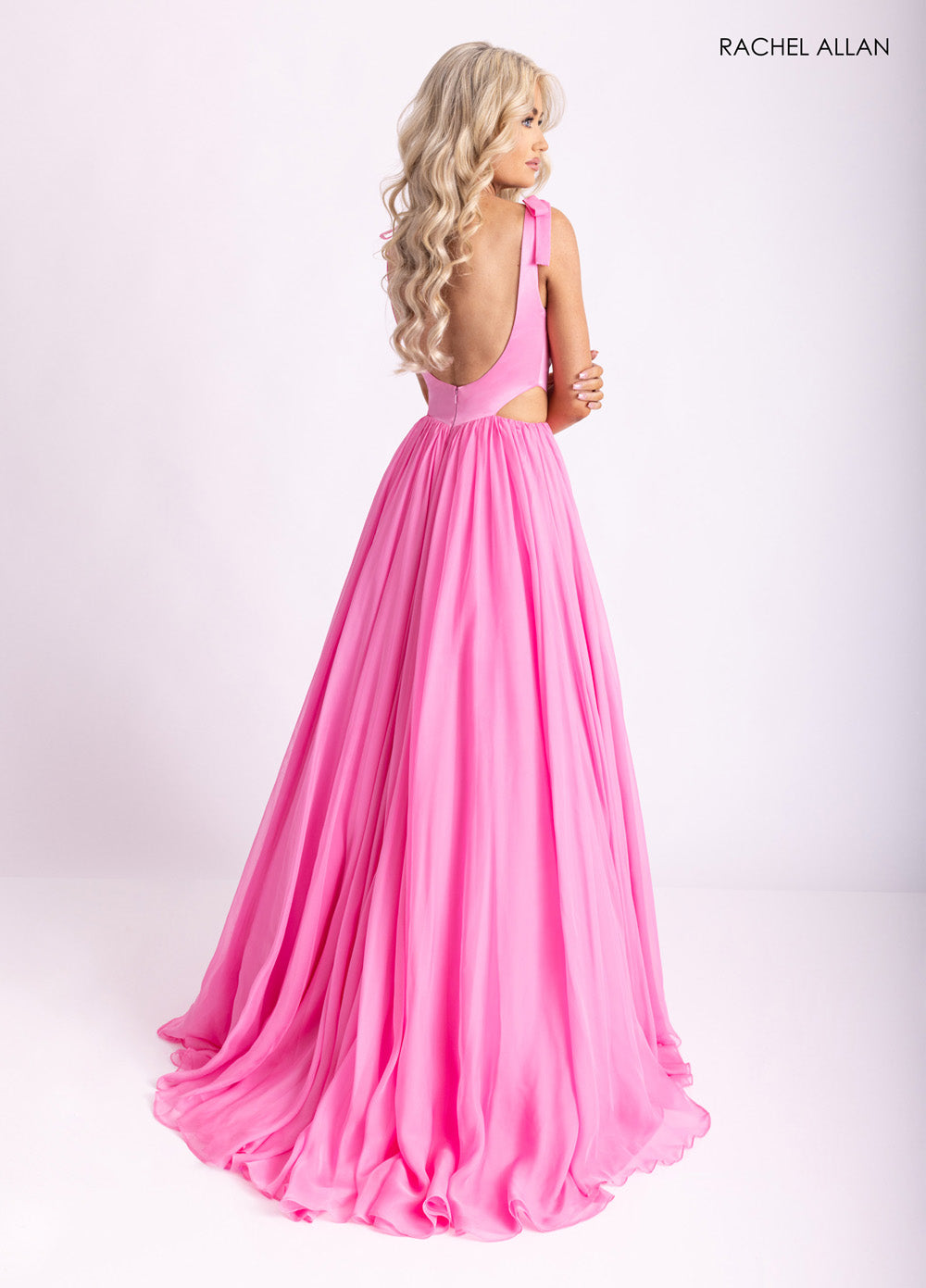 Rachel Allan 70980 Pink A-line prom dress with a lace-up low back and stunning straps.