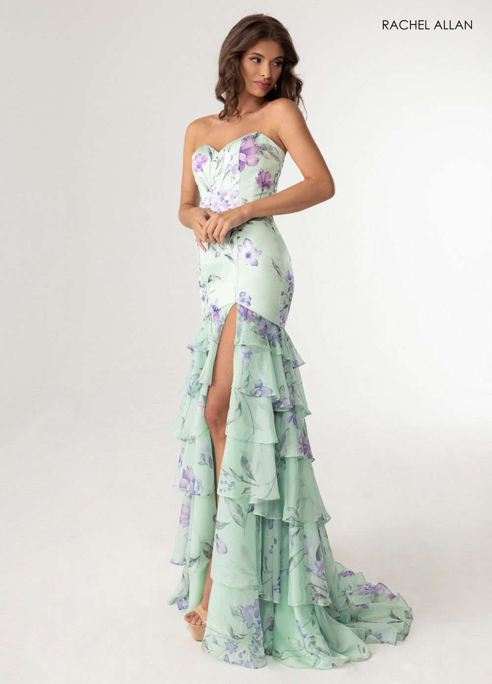 Rachel Allan 70995 Sage multi prom dress with a corset bodice and high slit, featuring ruffled layers.