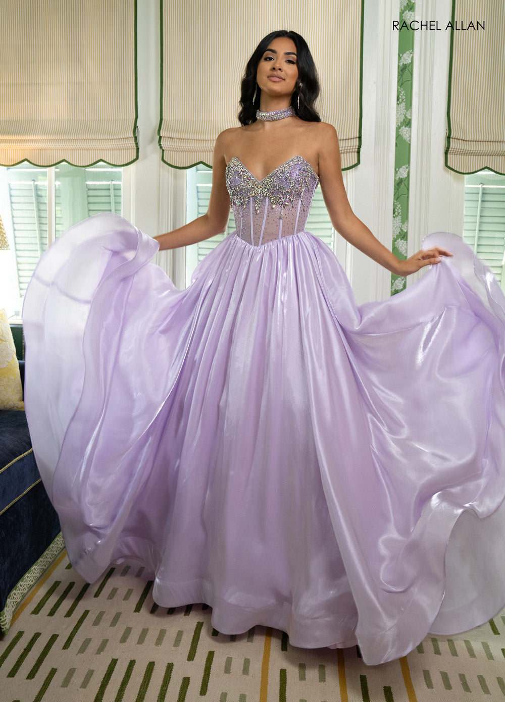 Rachel Allan 70998 Lilac prom dress with corset bodice and crystal beading, flowing A-line silhouette.