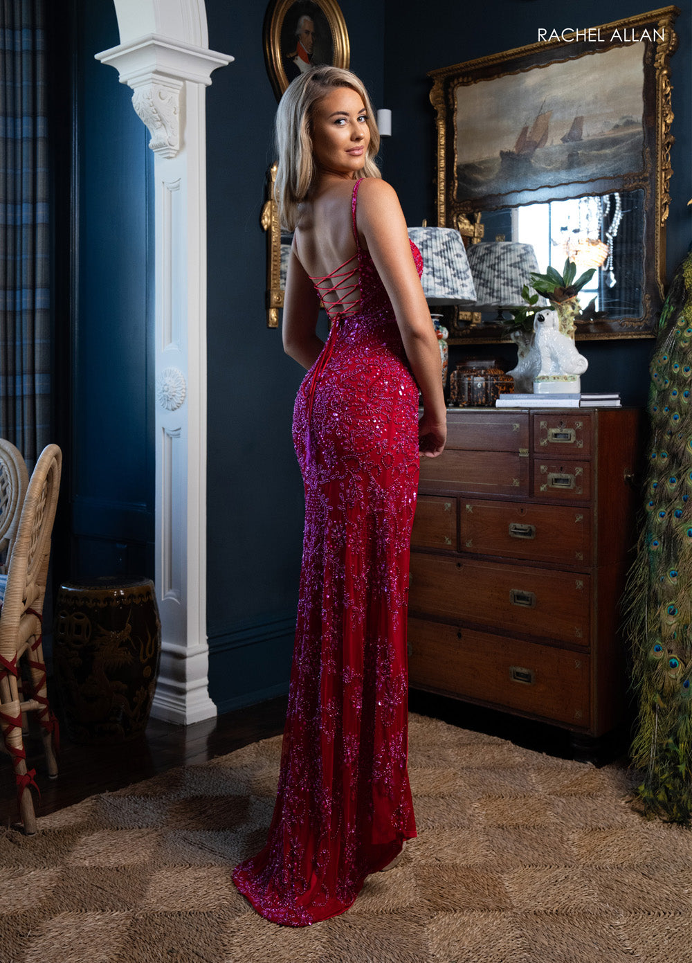 Rachel Allan 70999 Red fitted prom dress with beading and a lace-up back, back view.
