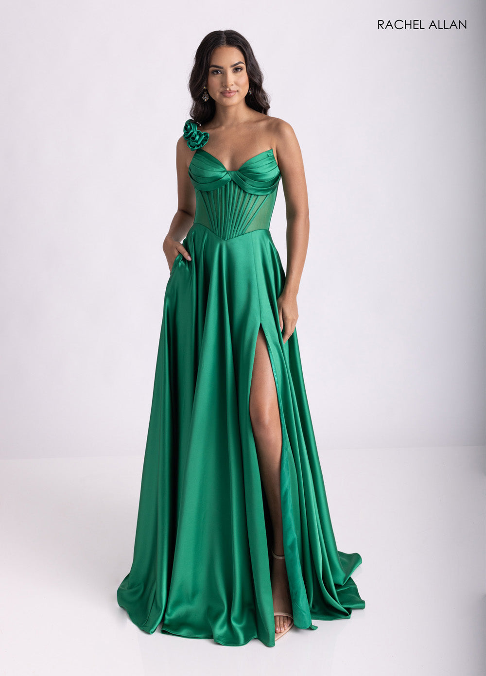 Rachel Allan 71004 Emerald satin prom dress with corset bodice and side slit, front view.