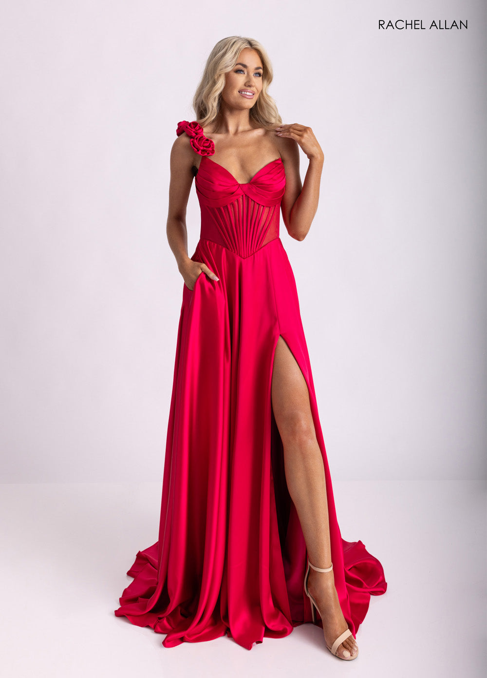 Rachel Allan 71004 Lipstick prom dress with a mermaid silhouette and a thigh-high slit.