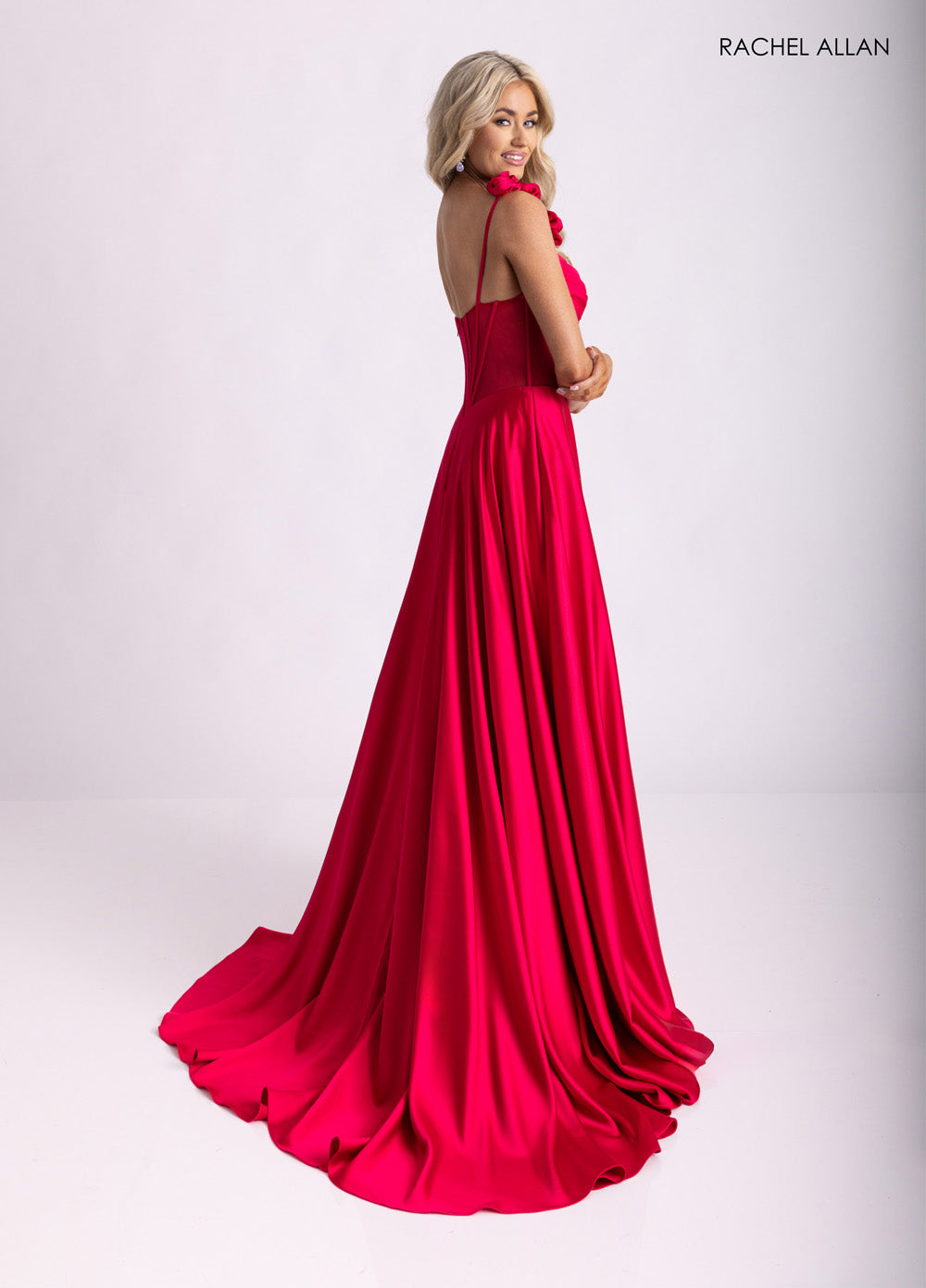 Rachel Allan 71004 Lipstick prom dress with a corset bodice and flowing skirt, back view.