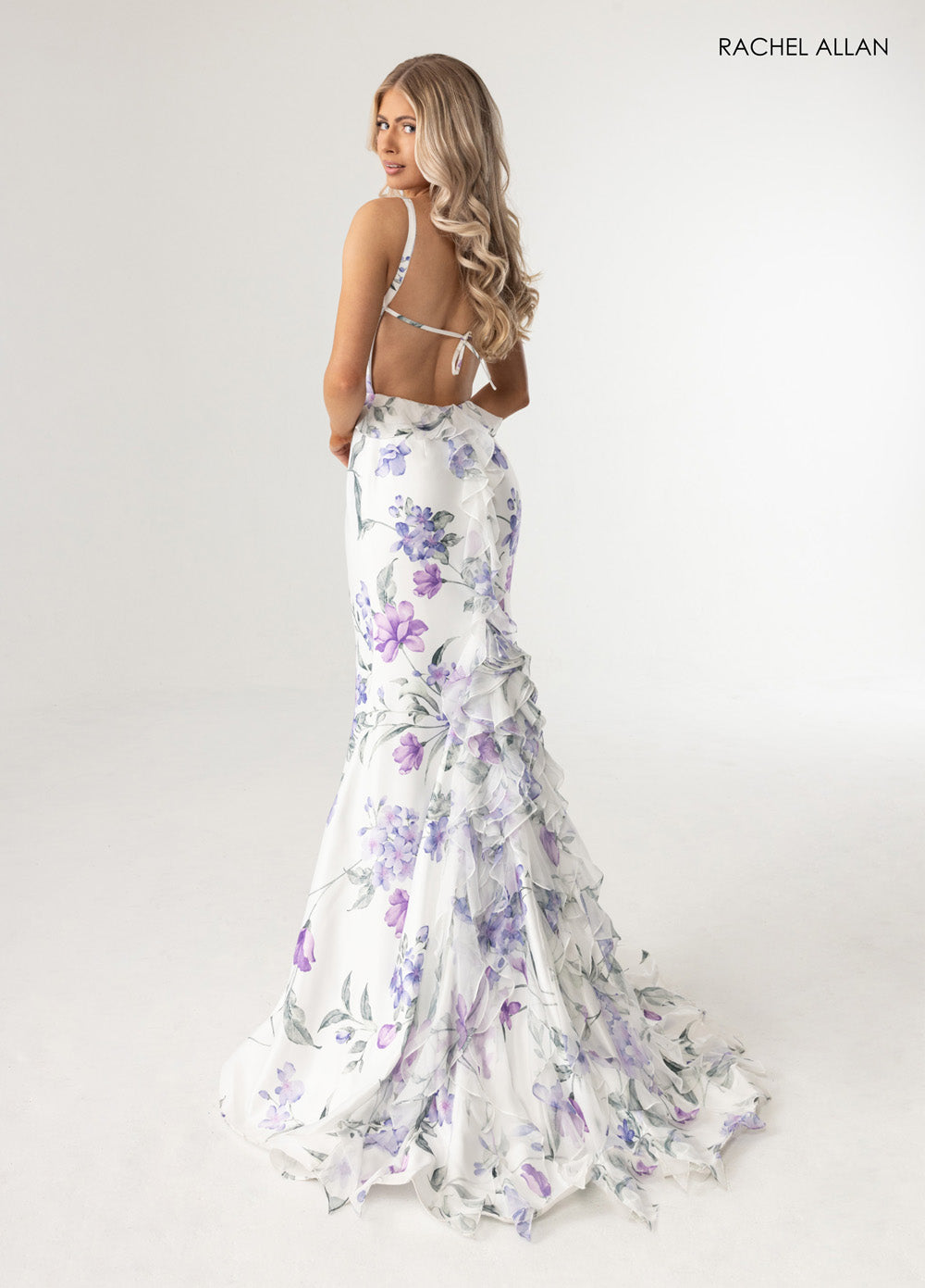 Rachel Allan 71023 Mermaid prom dress in white multi with ruffled detailing and open back view.