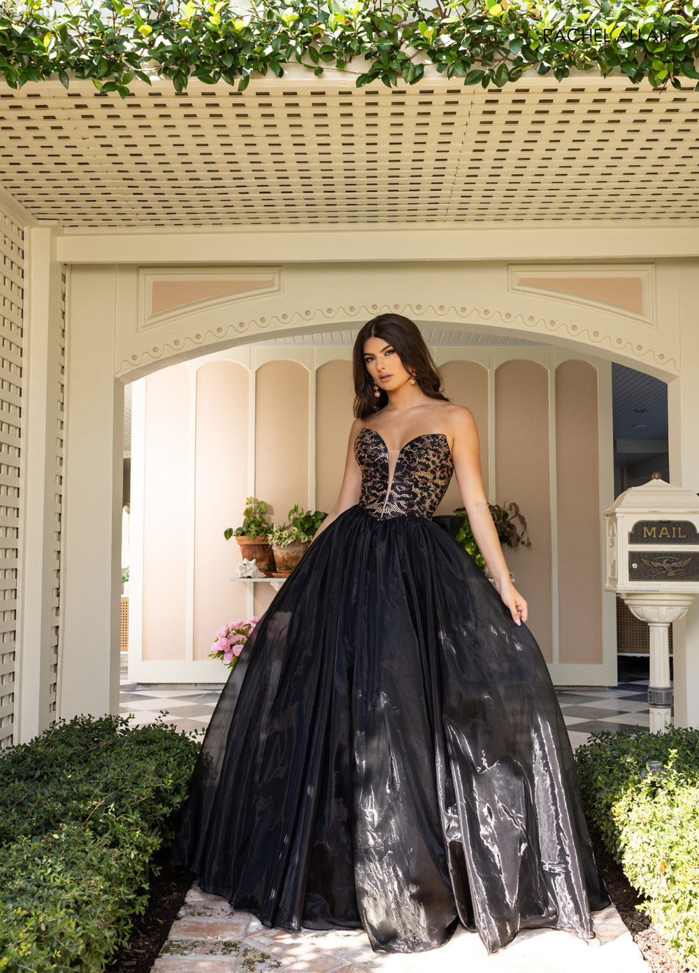Rachel Allan 71026 Black cheetah prom dress with crystal beading and a flowing ballgown silhouette.
