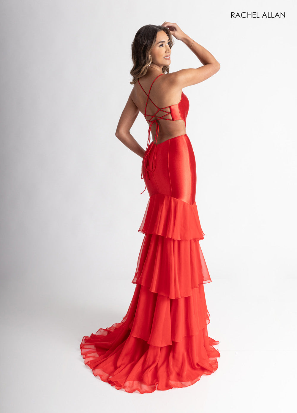 Rachel Allan 71027 Red mermaid prom dress with a tiered chiffon skirt and lace-up back detail.